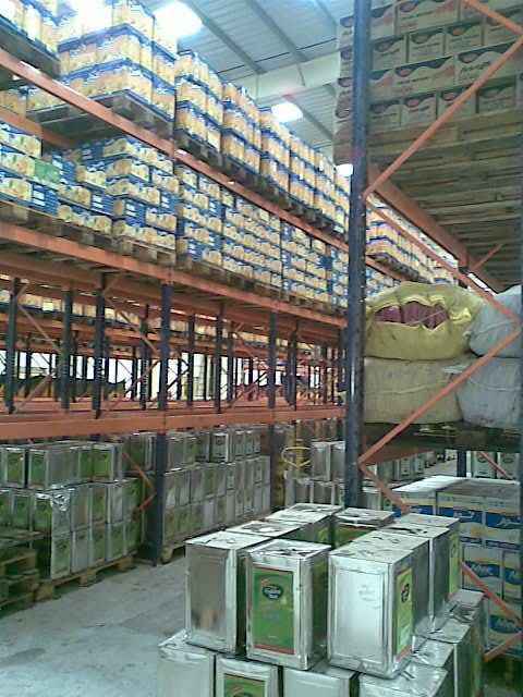 KSP SafeVault industrial shelving with heavy duty racking storing stacked boxes and metal containers in warehouse