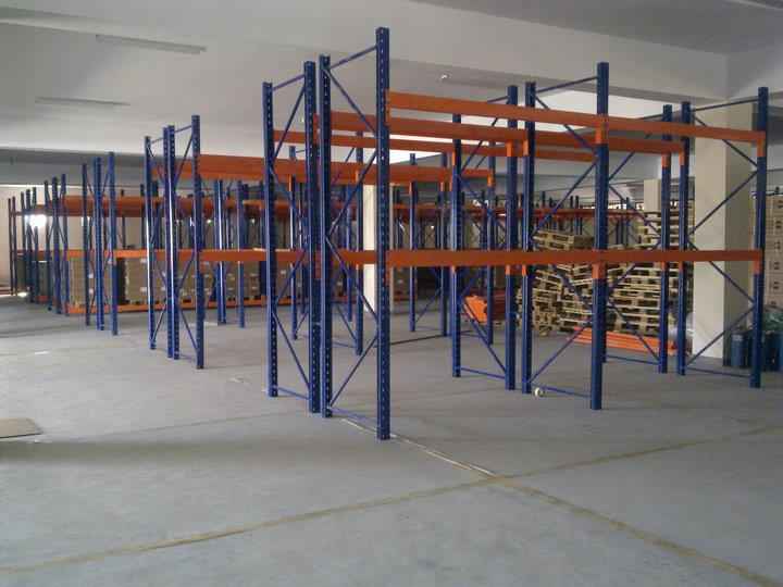 KSP SafeVault industrial shelving with medium duty racking in a spacious warehouse setting