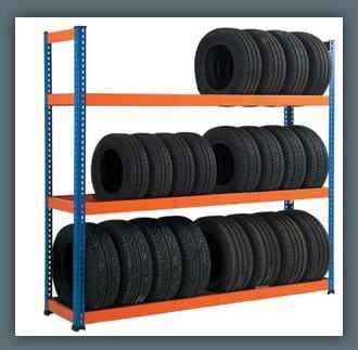 KSP SafeVault industrial shelving with blue frame and orange beams holding multiple tires medium duty racking