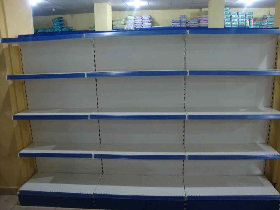 KSP sturdy supermarket shelving with multiple blue and white wall shelves and ledges for organized display